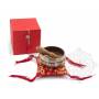 Idée cadeau incluant un bol de méditation rouge avec coussin coordonné et stick !