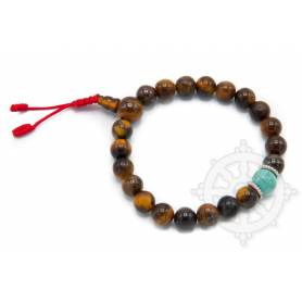 Malas pour poignet composé de 20 perles oeil-de-tigre jaunes(8mm), 1 turquoise(10mm)