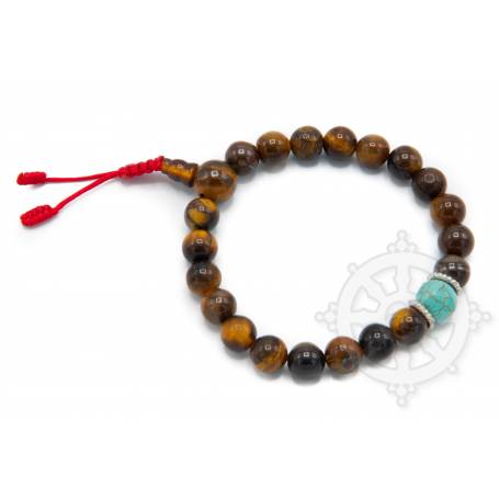 Malas pour poignet composé de 20 perles oeil-de-tigre jaunes(8mm), 1 turquoise(10mm)
