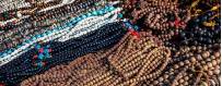 Mala, bracelets, wooden rosary and precious stones